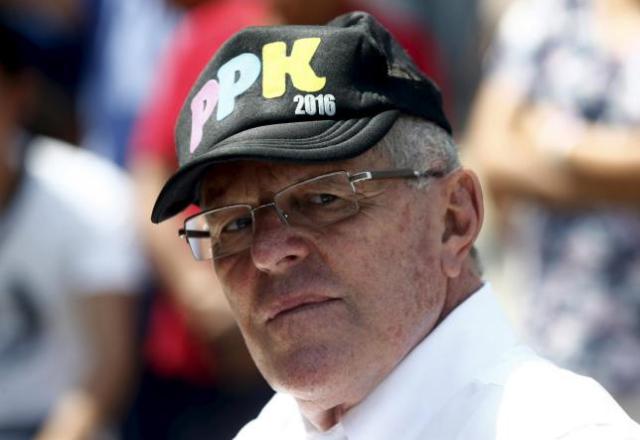 Peru's presidential candidate Pedro Pablo Kuczynski of "Peruanos Por El Cambio" party attends a meeting with school principals at Independencia district of Lima